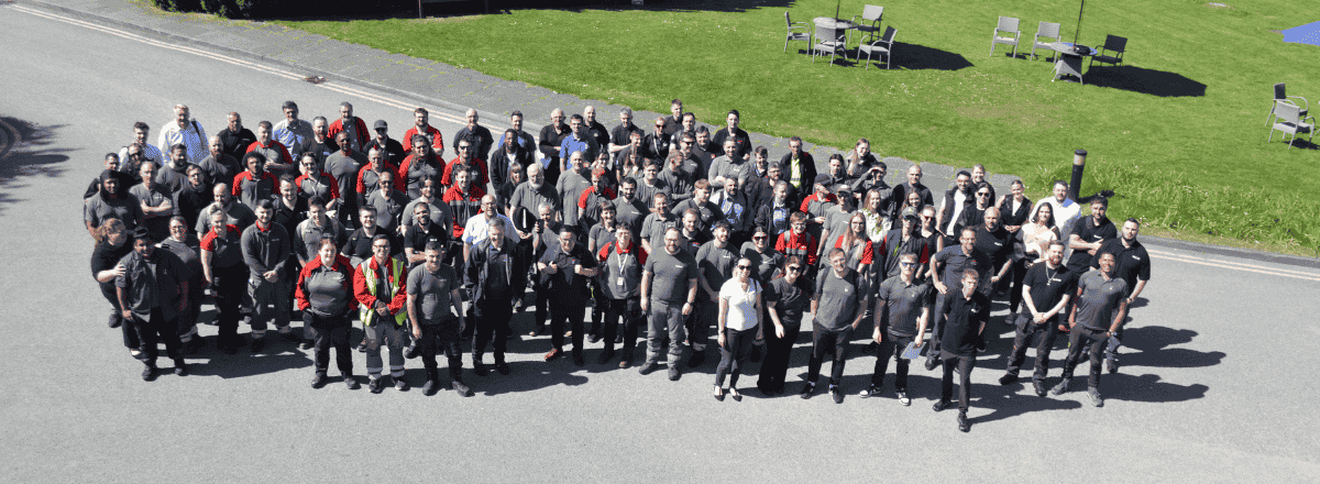 Homepage of Rentokil Initial displaying uniformed employees to represent the company's professional pest control and hygiene service teams.